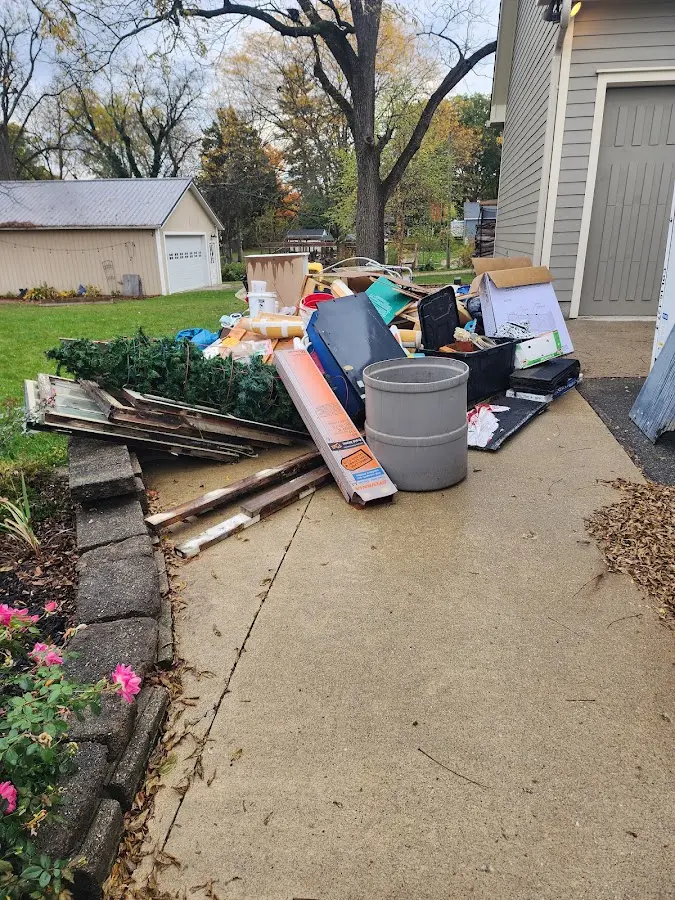Dumpster being loaded with debris for Residential Dumpster Rental in Norwalk
